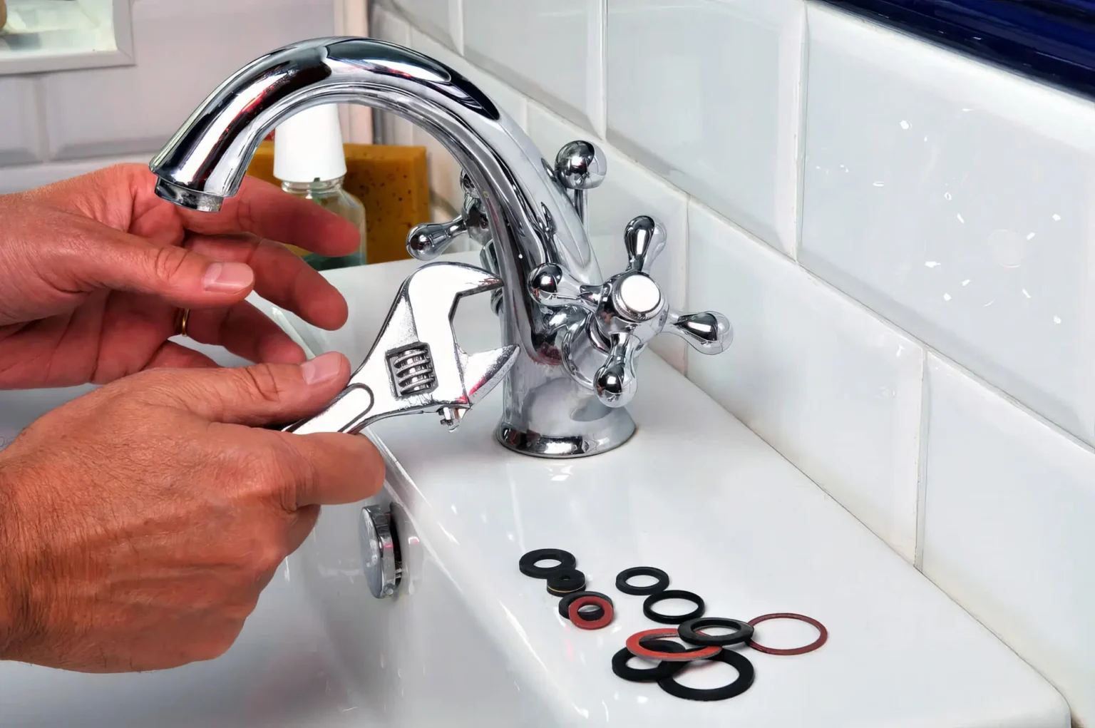 Plumber maintaining a bathroom faucet in Laguna Beach